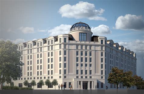 Elewacja hotelu z oranżerią, sugerująca nowoczesność połączoną z historycznym charakterem