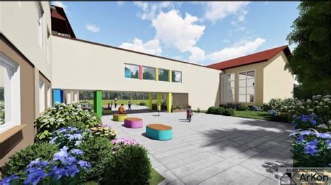 Architektura nowoczesnej szkoły z przestronną salą gimnastyczną, symbolizująca nowe możliwości edukacyjne.